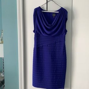 New without tags. Never worn. Flattering ruching and drape neckline.